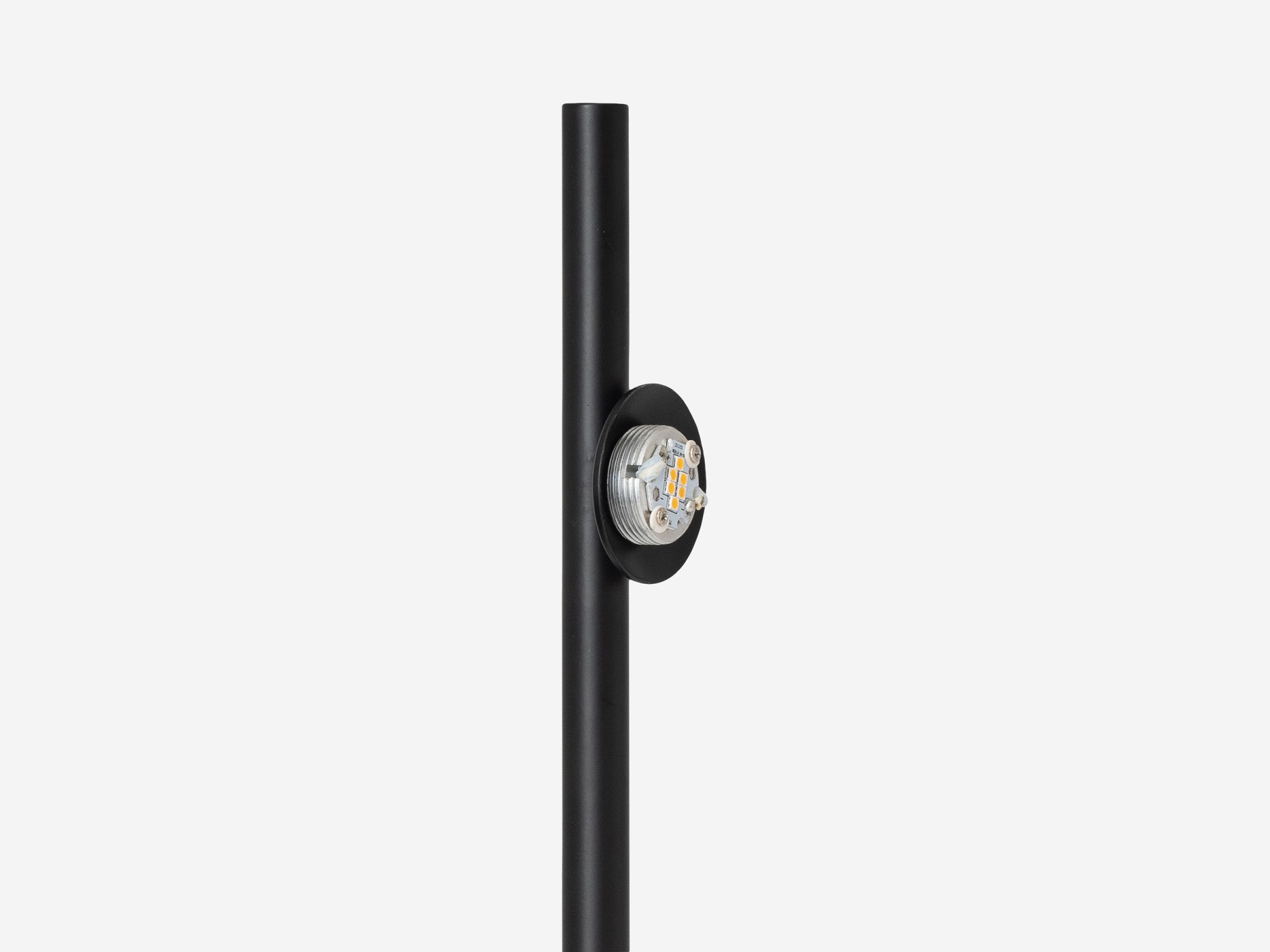 detail view of the eq3 black stem table lamp without cover